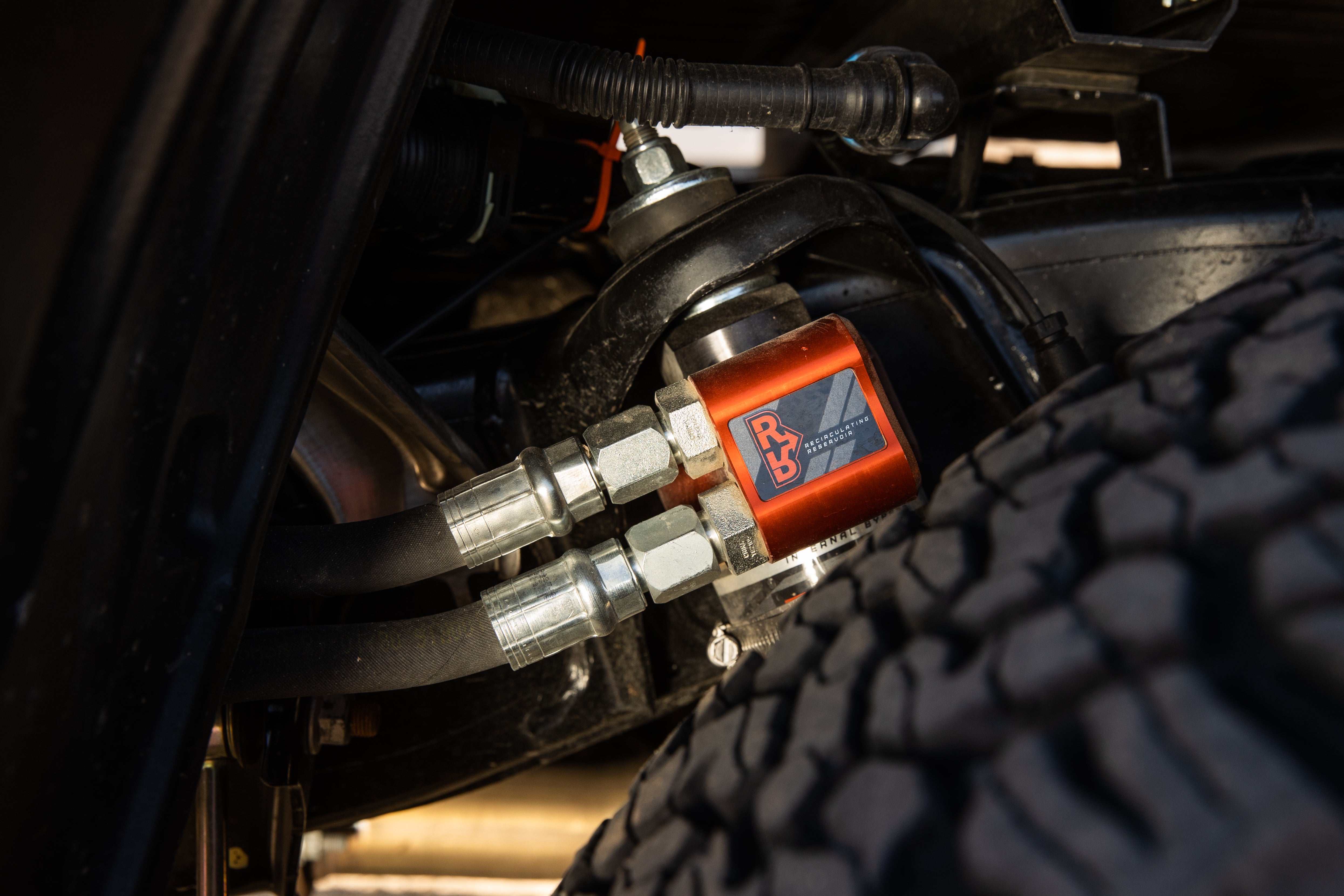 '22-24 Toyota Tundra FOX 3.0 FACTORY RACE RR Coilovers & Rear Shocks (0-1" Lift) w/ Upper Arms & Trailing Arm Combo Kit Close-up Display on vehicle