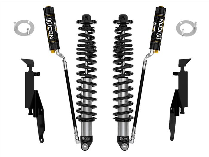 The image shows a set of black coilovers with dual rate coil springs and CDCV valves, including remote reservoirs and mounting hardware, isolated on a white background.