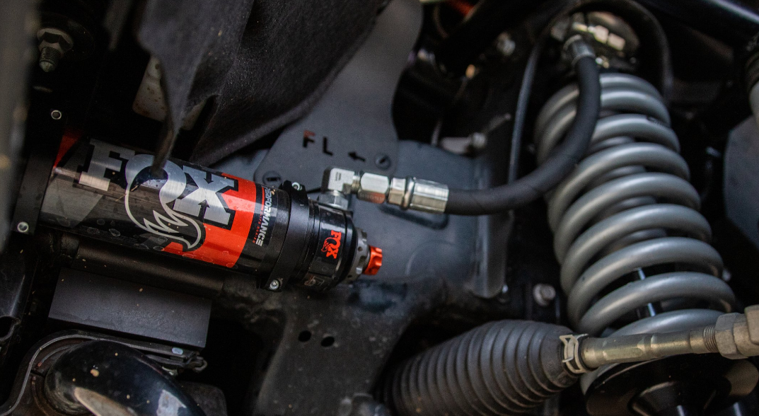 '22-23 Toyota Tundra FOX 2.5 ELITE SERIES RR Coilovers & Rear Shocks (w/ 0-1.5" Rear Lift) w/ Upper Arms & Trailing Arm Combo Kit Close-up Display on Vehicle