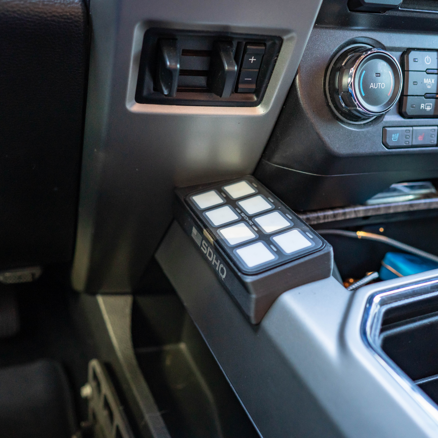 '21-24 Ford Raptor SDHQ Built Switch-Pros SP-9100 Flow Through Center Console Keypad Mount installed