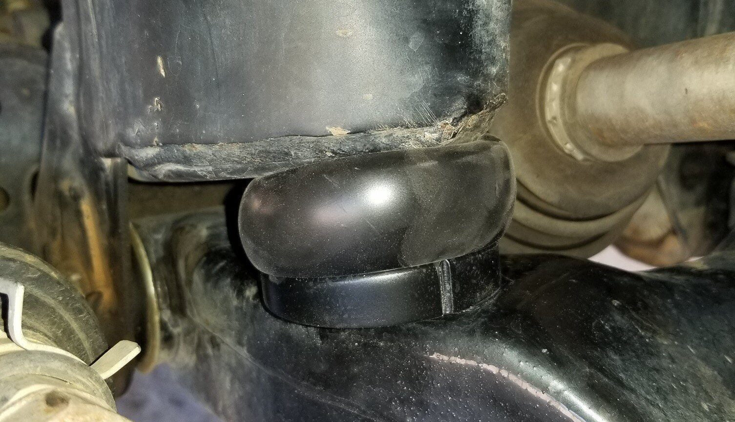 '95-04 Toyota Tacoma DuroBumps Front Bump Stops - DBF24R Close-up Display on Vehicle