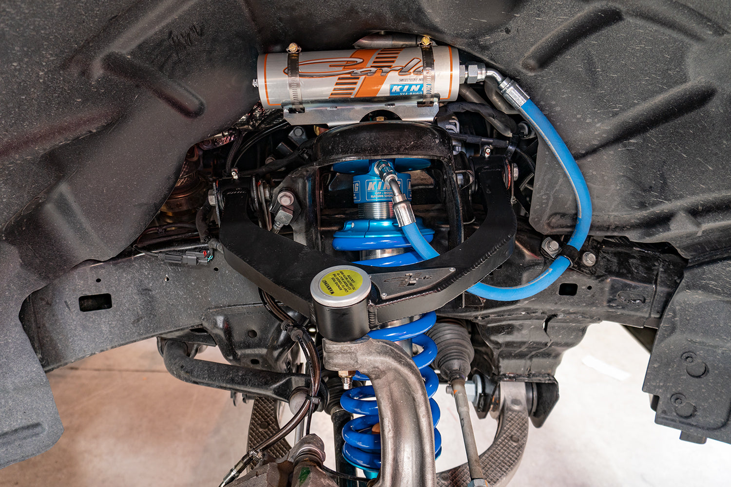 '19-24 Ram 1500 Rebel Carli 2.5 Performance Suspension System w/ Heavy Duty Rear Coil Springs Close-up Display on Vehicle