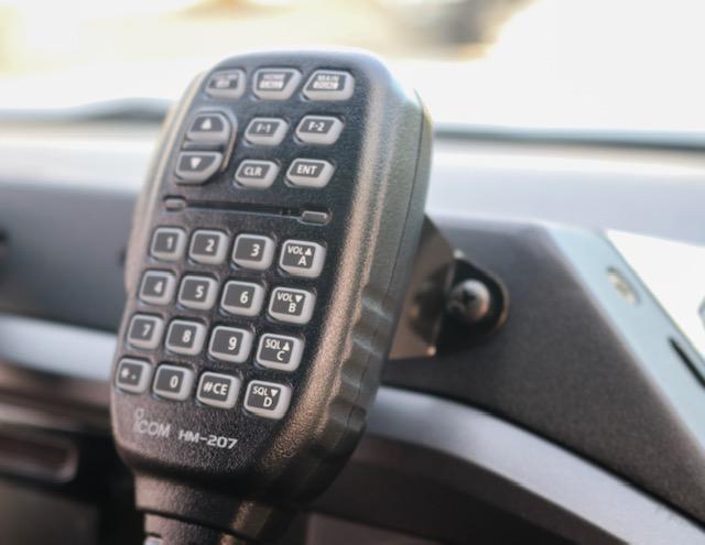 CB Mic and Handheld Radio Holder Close-up Display in vehicle