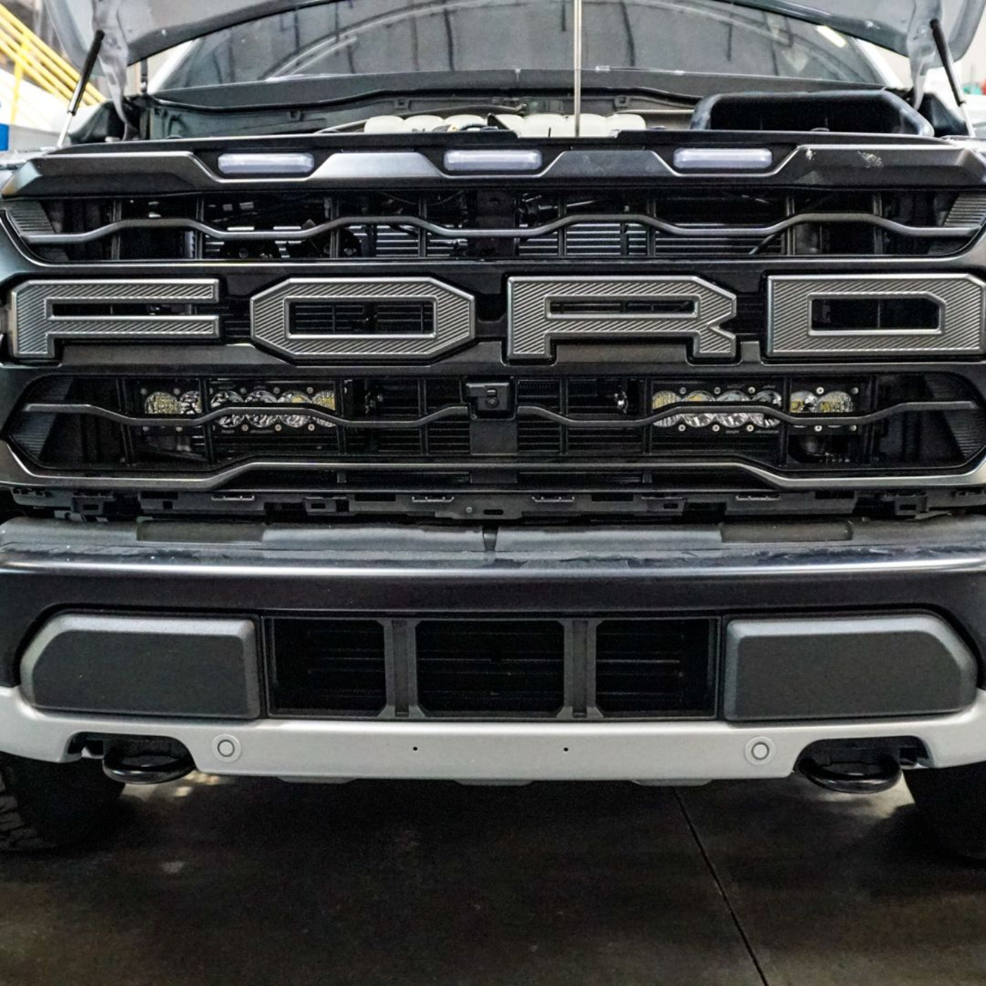 SDHQ Built '21-25 F150 / Raptor Behind the Grille Light Mounting Kit installed               
